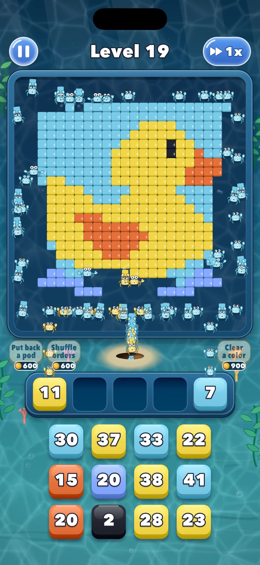 A yellow rubber duck made of blocks while crabs fetch the yellow blocks they can reach